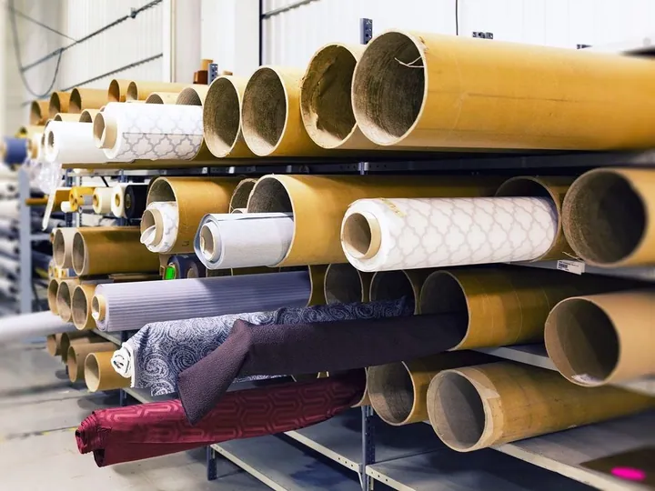 Rolls of fabric stored on shelving