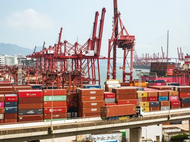 Cargo containers and cranes at a Hong Kong port